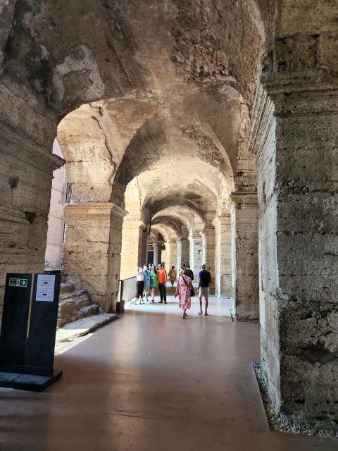 Rome: Colosseum, Roman Forum, and Palatine Hill Ancient Tour - Entering the Colosseum and the First Two Rings